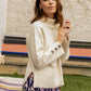 Maglione dolcevita in maglia Matis con polsini a bottoni