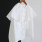 Blusa corta con balze e maniche a sbuffo in misto cotone