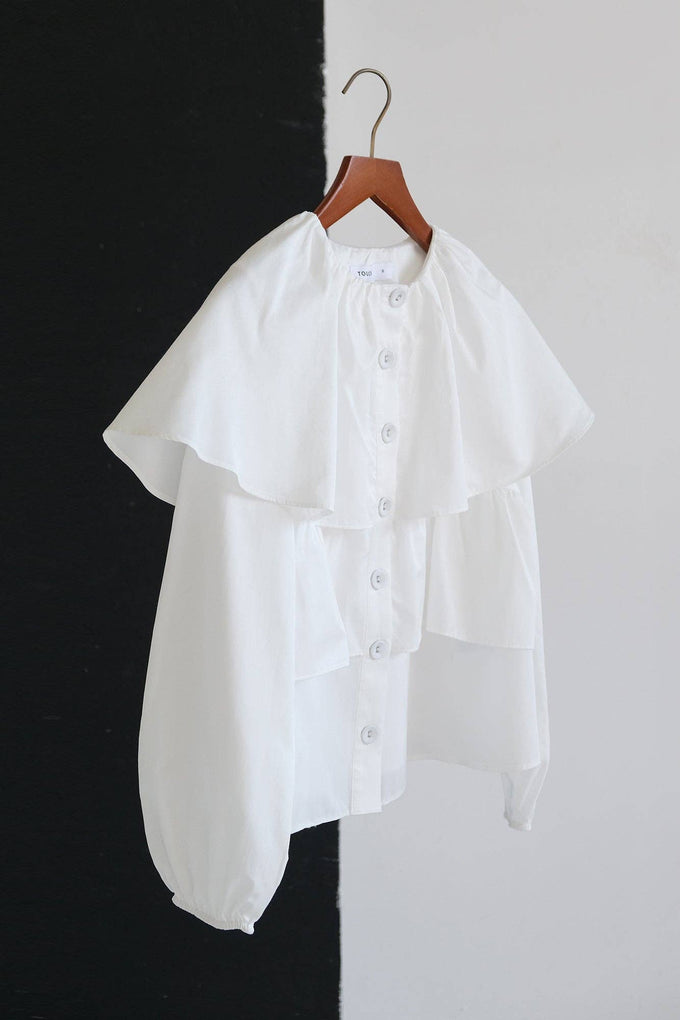 Blusa corta con balze e maniche a sbuffo in misto cotone