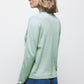Maglione in maglia rasata con fiocco e scollo a V
