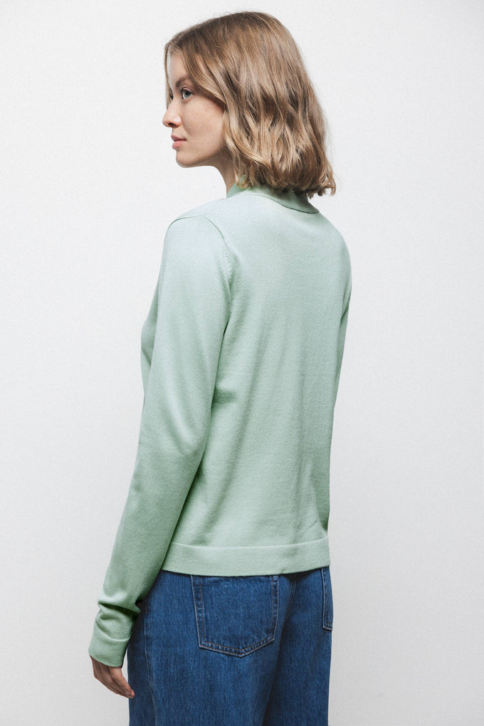Maglione in maglia rasata con fiocco e scollo a V
