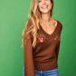 Maglione con scollo a V ricamato beige