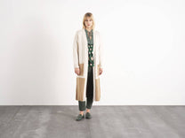 Cardigan lungo in maglia bicolore con tasche