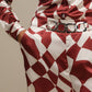 Pantaloni a palazzo con stampa geometrica color ruggine