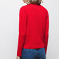 Maglione in maglia rasata con scollo a V e fiocco