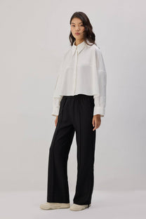 Pantaloni in crêpe con frange
