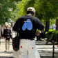 T-shirt oversize nera con stampa spray