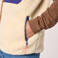 Gilet sherpa unisex con zip avorio e blu