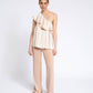 Blusa monospalla con volant