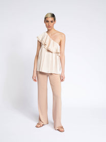 Blusa monospalla con volant