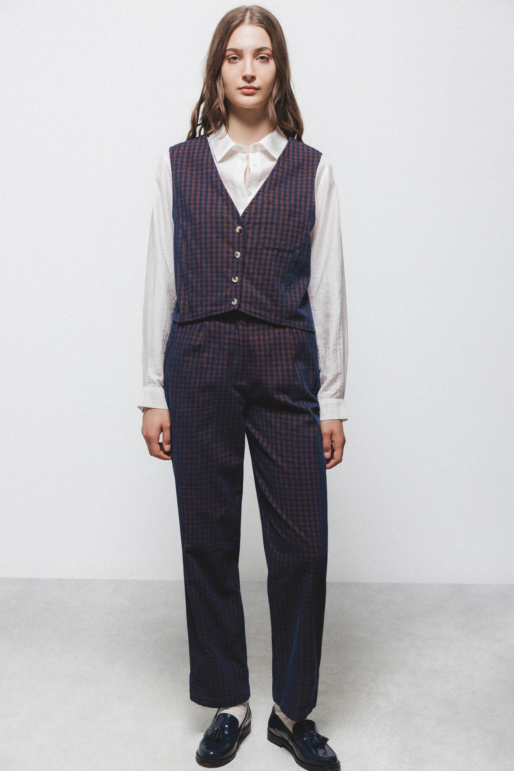 Gilet a quadri con scollo a V
