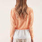 Maglia in cotone con balza ricamata
