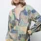 Blusa patchwork multicolor con scollo a V