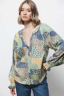 Blusa patchwork multicolor con scollo a V