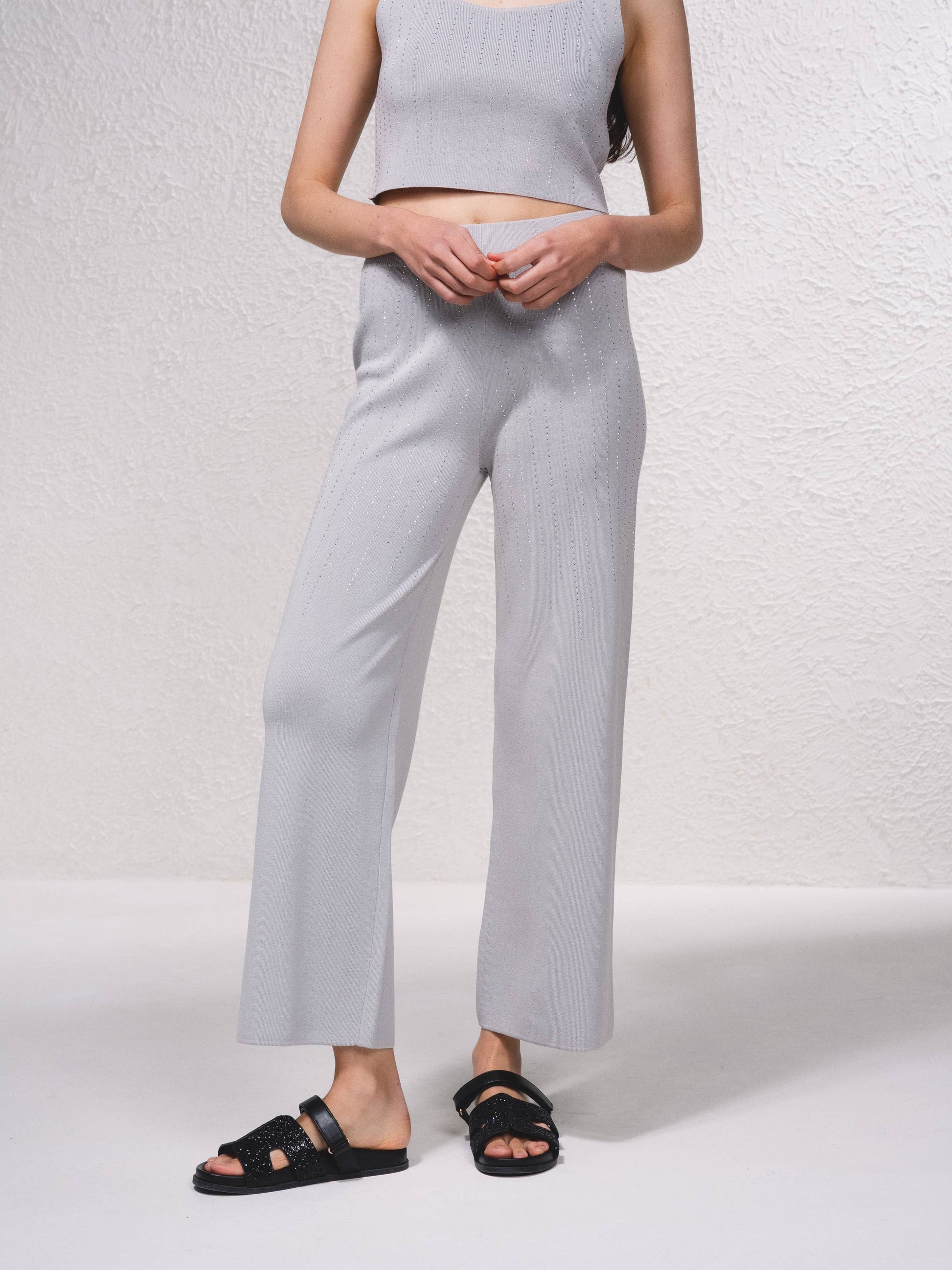 Pantaloni in maglia a gamba ampia con applicazioni glitter