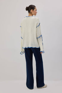 Cardigan in maglia con laccetti e profili a contrasto