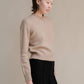 Maglione girocollo in tweed cropped in lana riciclata