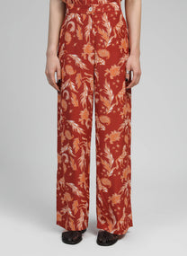 Pantaloni a vita alta terracotta con stampa frecce