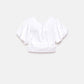 Top crop bianco con maniche a palloncino e cut-out