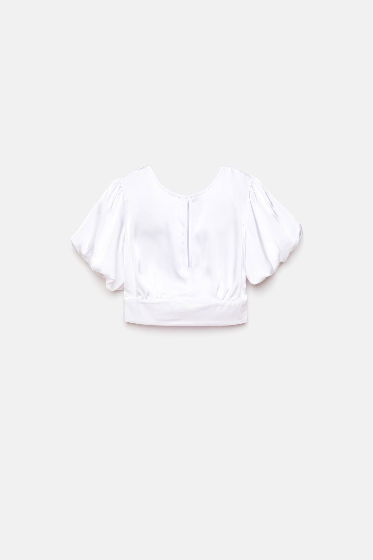 Top crop bianco con maniche a palloncino e cut-out
