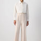 Pantaloni essenziali crema con orlo grezzo e cucitura frontale