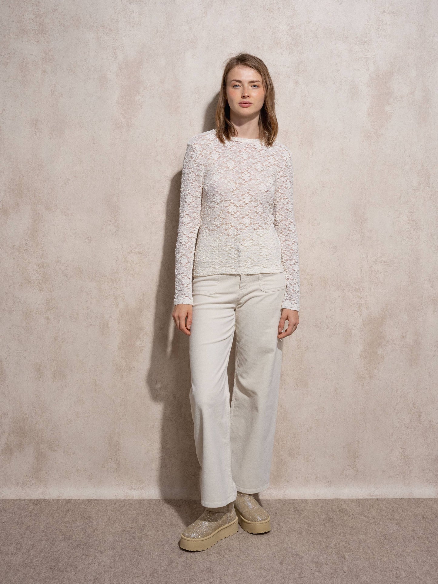 Blusa in pizzo elasticizzato
