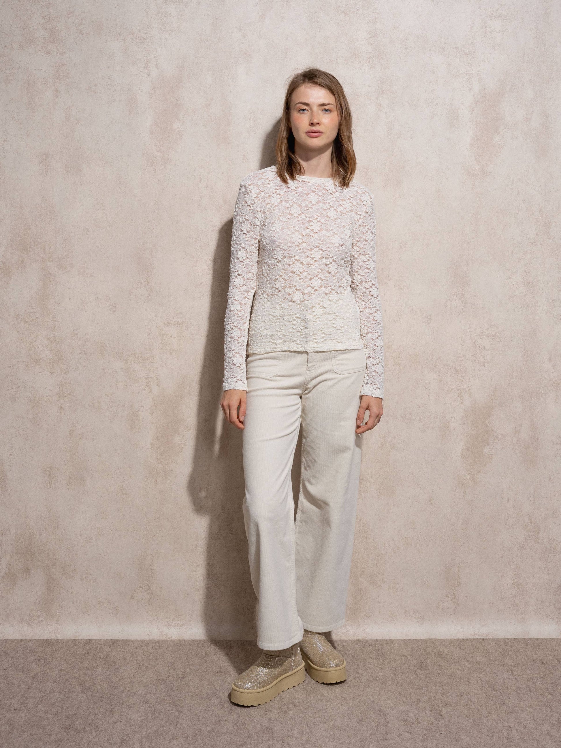 Blusa in pizzo elasticizzato