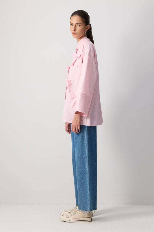 Camicia oversize in cotone a righe rosa con fiocchi