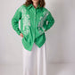 Camicia oversize verde ricamata con motivo astratto in misto cotone