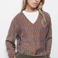 Blusa geometrica con scollo a V