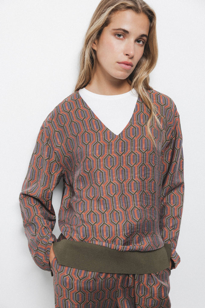 Blusa geometrica con scollo a V
