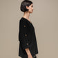 Maglione oversize con scollo a V e bottoni gioiello