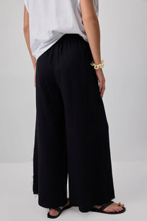 Pantaloni palazzo in cotone con dettagli sfrangiati
