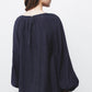 Blusa in tessuto effetto stropicciato con maniche a palloncino
