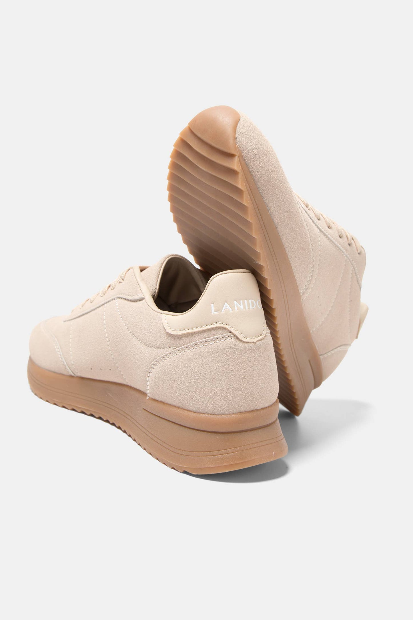 Sneakers bicolori con suola platform