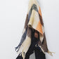 Poncho a quadri con frange