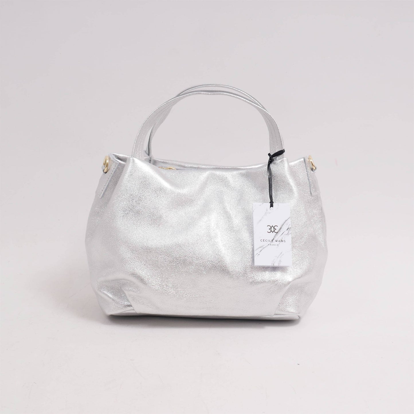 Borsa a mano e tracolla in pelle con finitura metallizzata