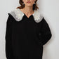 Maglione nero in maglia con colletto ricamato