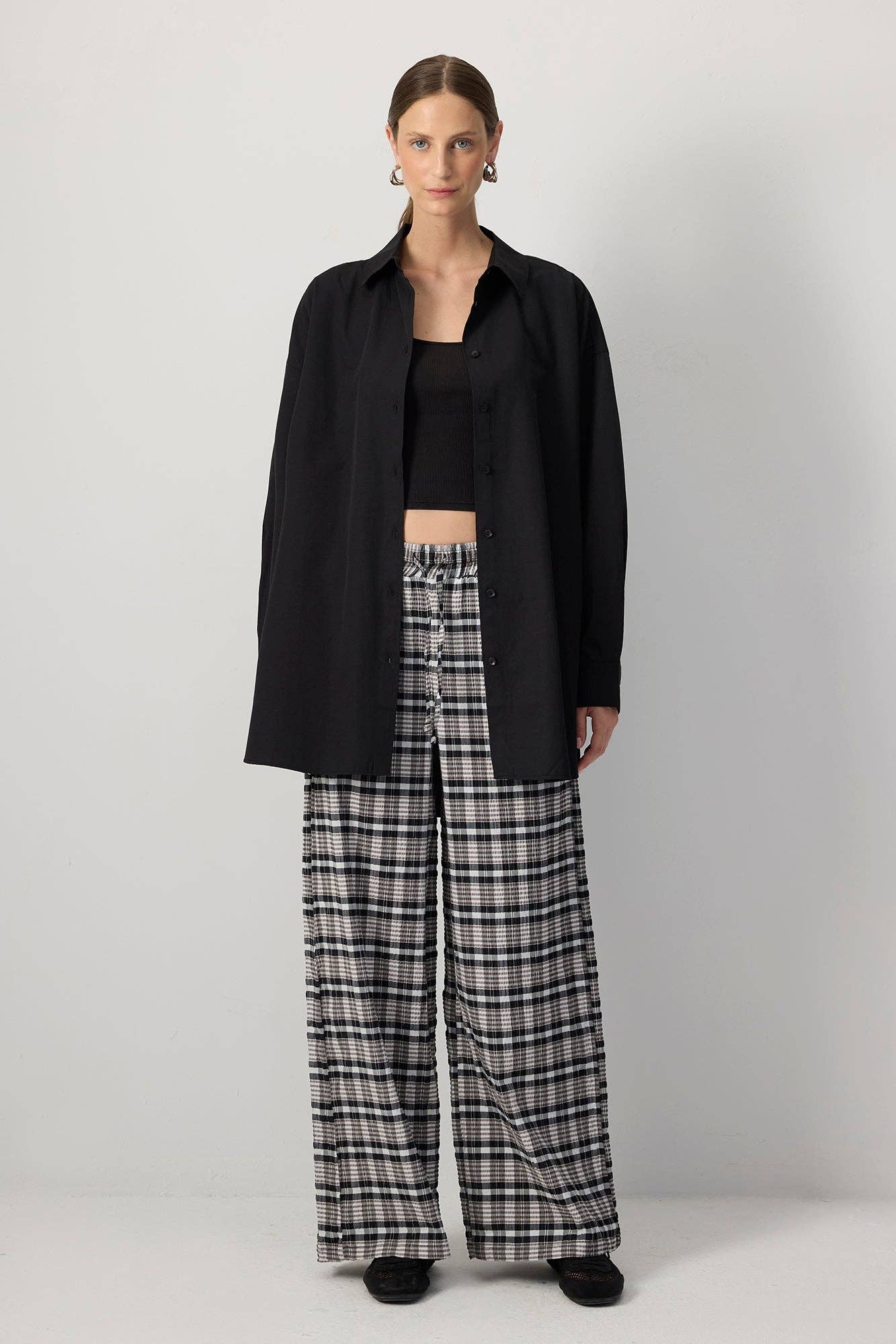 Pantaloni palazzo a quadri con vita elasticizzata