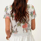 T-shirt in viscosa floreale con balza