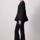 Blusa nera con balza asimmetrica