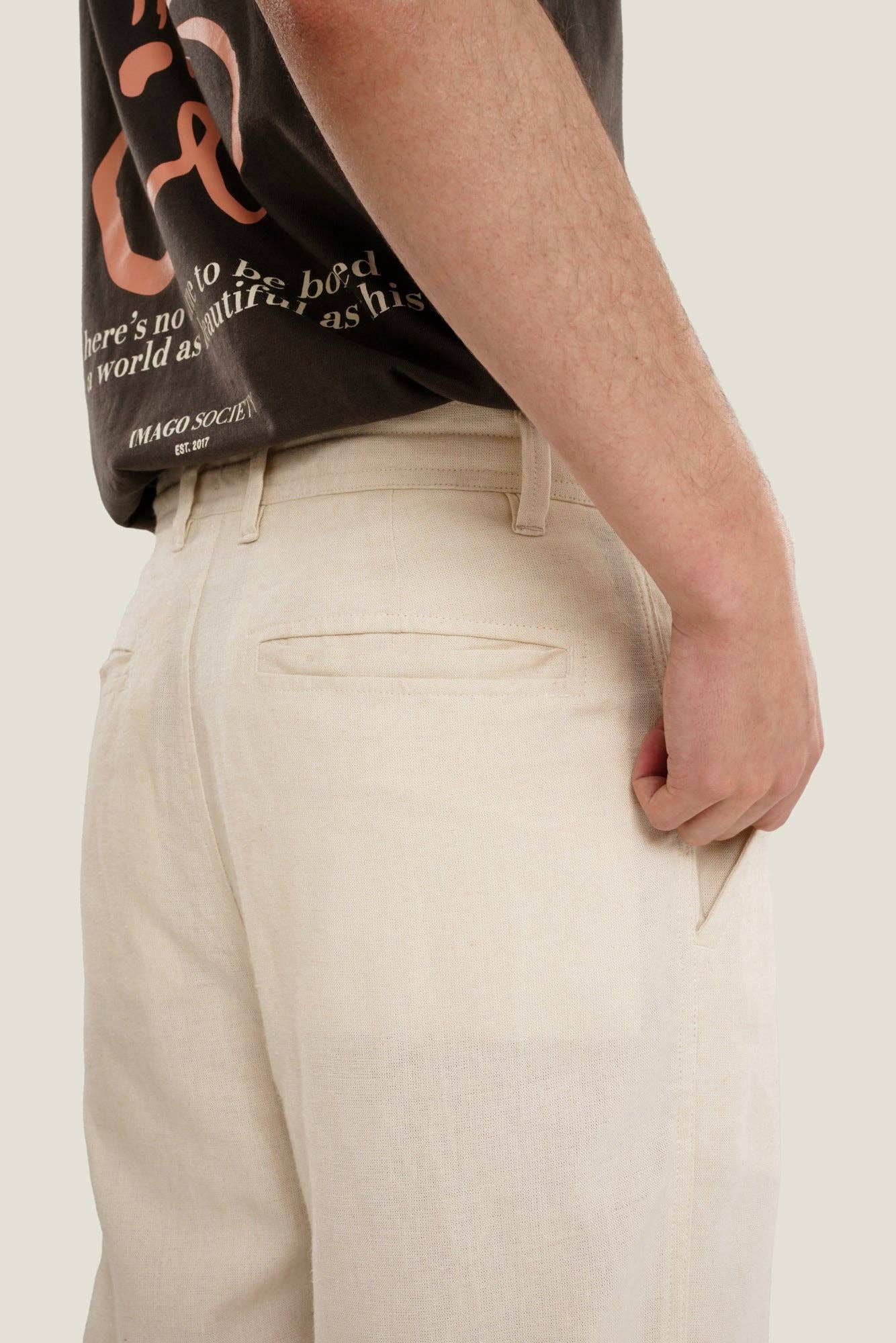 Pantaloni in lino a gamba dritta color crema