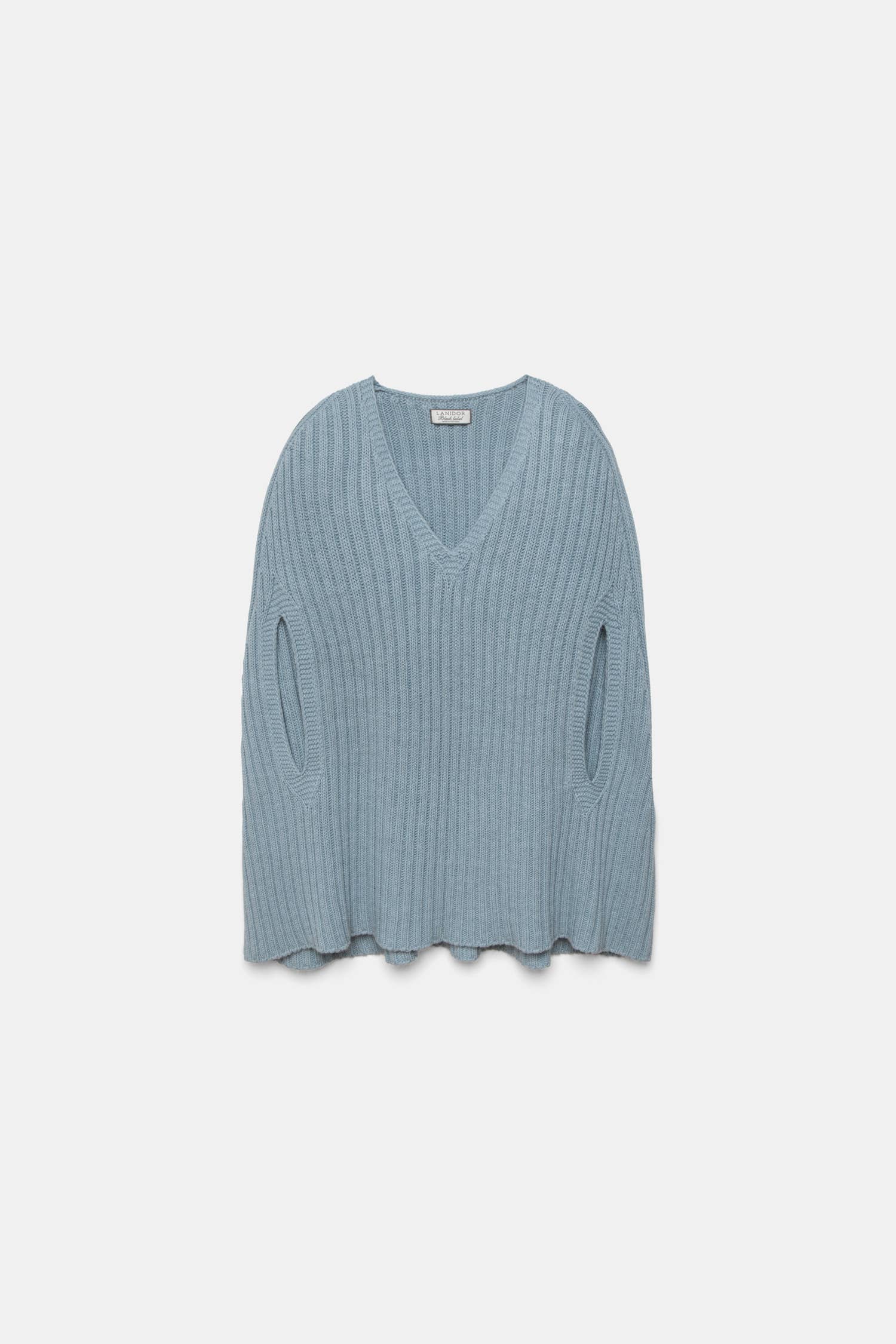 Poncho a coste con scollo a V
