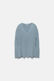 Poncho a coste con scollo a V