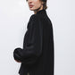 Blusa nera con fiocco al collo