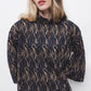 Blusa stampata con collo alto