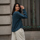 Blusa floreale con volant e scollo a V