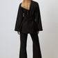 Blusa in crêpe nera con incrocio e lacci sul retro