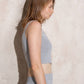 Top cropped in maglia con glitter
