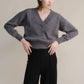 Maglione corto tweed con doppio scollo a V